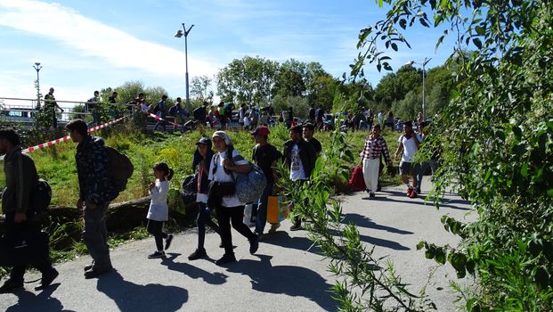 GERMANY, Freilassing: Refugees walk near the gates of Freilassing, Bavaria, on the German side of the Germany-Austria border, September 16, 2015.