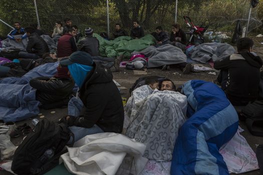 SERBIA, Horgos: Refugees lie and wait at the Serbia-Hungary border after Hungary closed the border crossing on September 16, 2015.****Restriction: Photo is not to be sold in Russia or Asia****