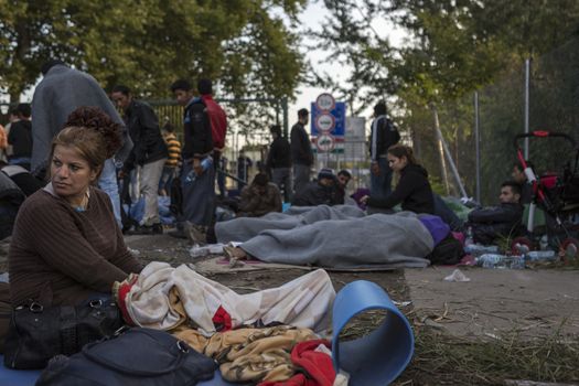 SERBIA, Horgos: Refugees wait at the Serbia-Hungary border after Hungary closed the border crossing on September 16, 2015.****Restriction: Photo is not to be sold in Russia or Asia****