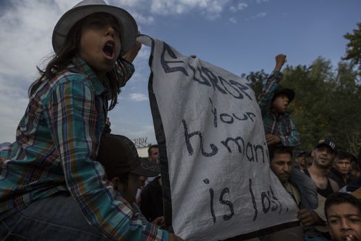 SERBIA, Horgos: Refugees demonstrate on the Serbian side of the Serbia-Hungary border after Hungary closed the border crossing on September 16, 2015.****Restriction: Photo is not to be sold in Russia or Asia****