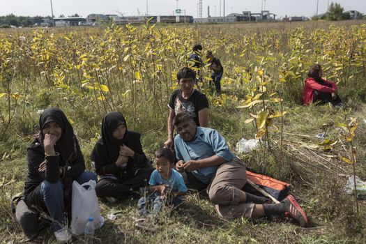 SERBIA, Horgos: Refugees wait at the Serbia-Hungary border after Hungary closed the border crossing on September 16, 2015.****Restriction: Photo is not to be sold in Russia or Asia****