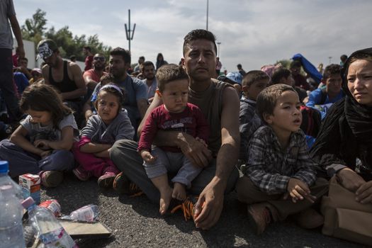 SERBIA, Horgos: Refugees wait at the Serbia-Hungary border after Hungary closed the border crossing on September 16, 2015.****Restriction: Photo is not to be sold in Russia or Asia****