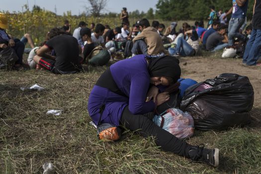 SERBIA, Horgos: Refugees wait at the Serbia-Hungary border after Hungary closed the border crossing on September 16, 2015.****Restriction: Photo is not to be sold in Russia or Asia****