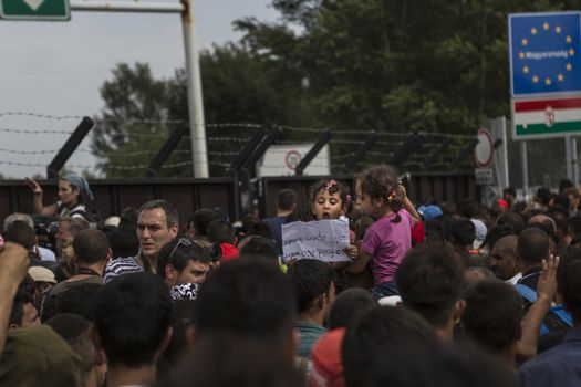 SERBIA, Horgos: Refugees wait at the Serbia-Hungary border, blocking traffic, after Hungary closed the border crossing on September 16, 2015.****Restriction: Photo is not to be sold in Russia or Asia****