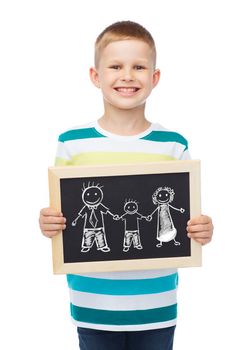 education, school and advertisement concept - smiling little boy holding black chalkboard with family drawing
