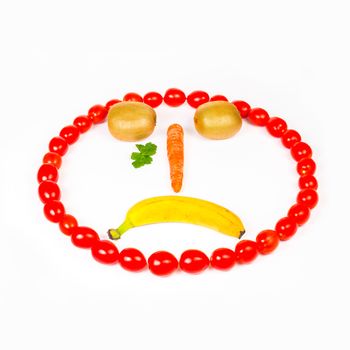 This cry smiley is made wirh carrot,kiwi,cherry tomatoes and banana .