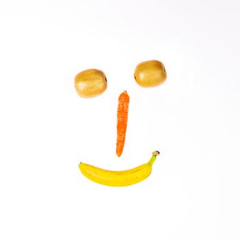This smiley is made wirh carrot,kiwi and banana.