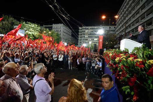 GREECE, Athens: General Secretary Dimitris Koutsoumpas (top right) of the Communist Party of Greece (KKE) speaks at a campaign rally in Athens on September 16, 2015, ahead of the forthcoming snap elections on September 20.