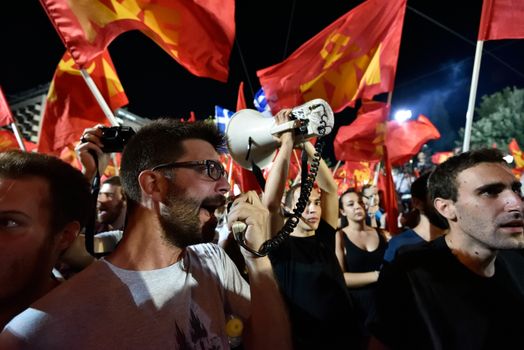 GREECE, Athens: A man speaks through a bullhorn as the Communist Party of Greece (KKE) holds a campaign rally in Athens on September 16, 2015, ahead of the forthcoming snap elections on September 20. At the rally, KKE General Secretary Dimitris Koutsoumpas addressed supporters.
