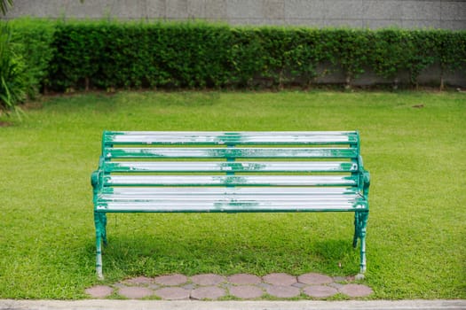 chair in the park with lawn in the background