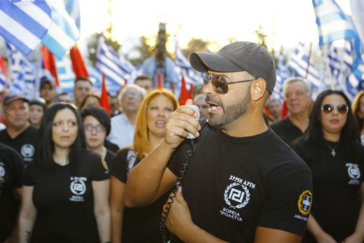 GREECE, Athens: A man shouts slogans to the crowd as Greece's far-right Golden Dawn party holds an election rally in Athens on September 16, 2015, four days ahead of the country's snap national election. 