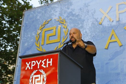 GREECE, Athens: Spokesperson Golden Dawn MP Ilias Panagiotaros addresses the crowd as Greece's far-right party holds an election rally in Athens on September 16, 2015, four days ahead of the country's snap national election. 