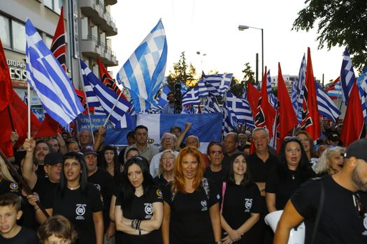 GREECE, Athens: Supporters gather as Greece's far-right Golden Dawn party holds an election rally in Athens on September 16, 2015, four days ahead of the country's snap national election. 