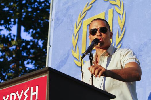 GREECE, Athens: Spokesperson Ilias Kasidiaris addresses the crowd as Greece's far-right Golden Dawn party holds an election rally in Athens on September 16, 2015, four days ahead of the country's snap national election. 