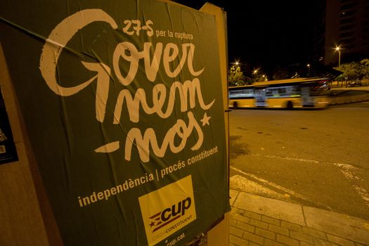 SPAIN, Barcelona: A poster supporting pro-independence political party Popular Unity Candidacy is displayed in Barcelona on the evening of September 16, 2015. Pro-independence groups are rallying their supporters ahead of the Catalonian parliamentary election, taking place on September 27.