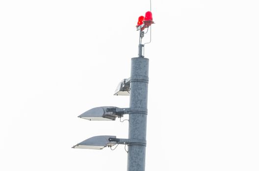 Tower at an international airport with lighting, landing lights. The lights are used for air traffic control.