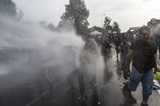 SERBIA, Horgos: Hungarian police fire tear gas and water cannons into the refugees in the Serbian border town of Horgos on September 16, 2015, after Hungary closed its border in an effort to stem the wave of refugees entering the country. ****Restriction: No Russia or Asia sales****