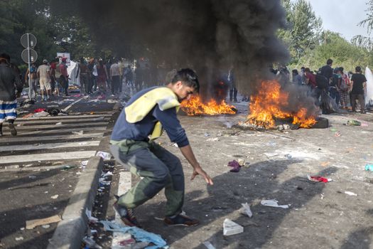 SERBIA, Horgos: Fires rage as Hungarian police fire tear gas and water cannons into the refugees in the Serbian border town of Horgos on September 16, 2015, after Hungary closed its border in an effort to stem the wave of refugees entering the country. ****Restriction: No Russia or Asia sales****