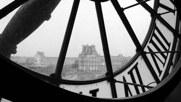 Large clocks with roman numerals in Museum d'Orsay to Musee du Louvre in Paris, France (Black and White)