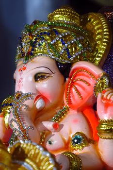 A royal Ganesha idol beautiful decorated and studded with precious gemstones.                               