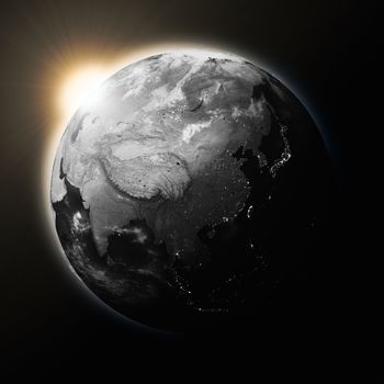 Sun over Southeast Asia on dark planet Earth isolated on black background. Highly detailed planet surface. Elements of this image furnished by NASA.