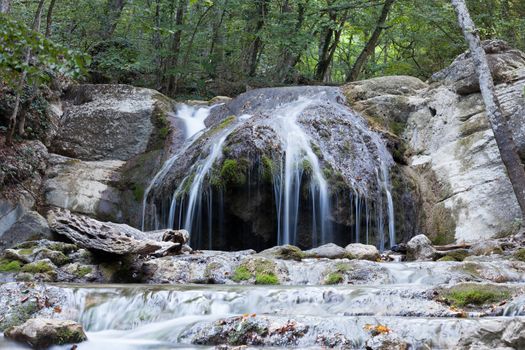 beautiful forest falls in mountains in the summer afternoon, the Crimea, Russia