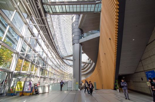 Tokyo, Japan - November 26, 2013: People visit Tokyo International Forum on November 26, 2013 in Tokyo Japan. the Forum is one of Tokyo's architectural marvels. Architect Rafael Vinoly won Japan's first international architecture competition with his design.