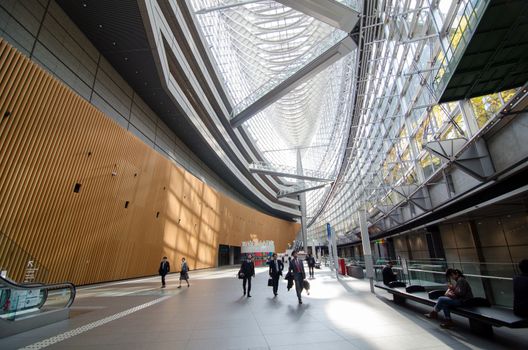 Tokyo, Japan - November 26, 2013: People visit Tokyo International Forum on November 26, 2013 in Tokyo Japan. the Forum is one of Tokyo's architectural marvels. Architect Rafael Vinoly won Japan's first international architecture competition with his design.