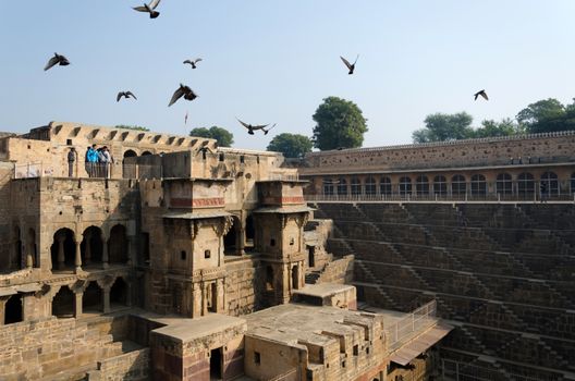 Jaipur, India - December 30, 2014: Tourist visit Chand Baori Stepwell, Jaipur, Rajasthan, India on December 30, 2014.  It was built by King Chanda of the Nikumbha Dynasty between 800 and 900 AD 