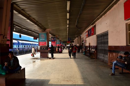 Jaipur, India - January 3, 2015: Crowd on platforms at the railway station of Jaipur, Rajasthan, India. Indian Railways carries about 7,500 million passengers annually.
