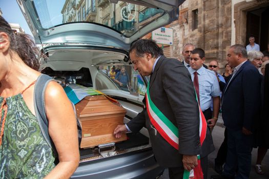 ITALY, Palermo: 	The funeral of Giovanni Lo Porto was held on September 18, 2015, with Mayor Leoluca�Orlando declaring a day of mourning in the city.  	Lo Porto, an aid worker, was being held captive by al-Qaida along with American Warren Weinstein.  	The pair were mistakenly killed during a U.S. drone strike in January. 