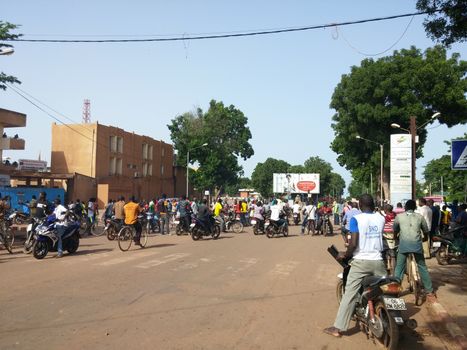 BURKINA FASO, Ouagadougou : Protestors react during a protest against the military coup near place de la Nation in Ouagadougou, Burkina Faso, on September 17, 2015. Protests have sparked in Ouagadougou after Presidential guard officers seized power in a coup. 