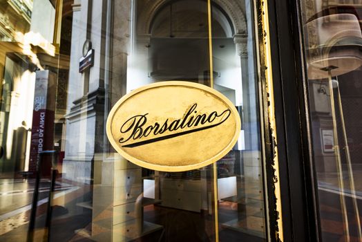 MILAN, ITALY - AUGUST 29 2015: Borsalino golden store window in galleria Vittorio Emanuele II, Milan's fashion district. August, 29 2015.