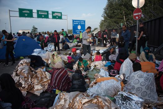 SERBIA, Horgos: Refugees, who wait to cross the border, have set their camp in the Serbian border town of Horgos on September 16, 2015.  