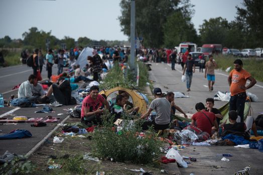 SERBIA, Horgos: Refugees, who wait to cross the border, have set their camp in the Serbian border town of Horgos on September 16, 2015.  