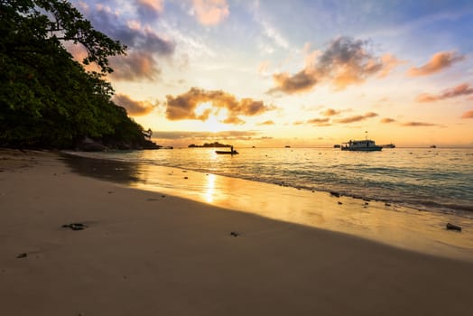 Beautiful landscapes of golden light the sky over the beach and sea during sunrise on Koh Miang Islands, Mu Ko Similan National Park, Phang Nga, Thailand