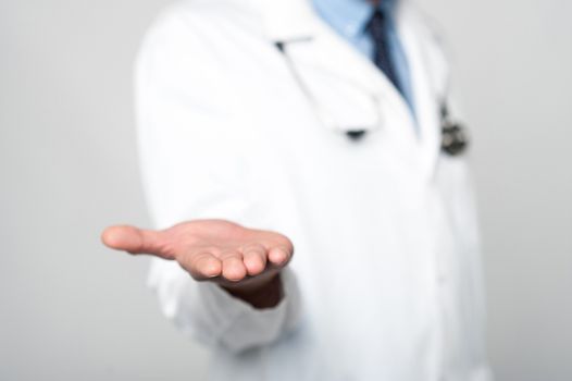 Cropped image of male doctor shows empty palm