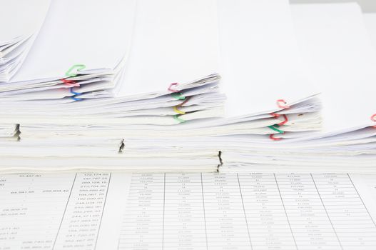 Step pile of paperwork and paper of report on finance account.