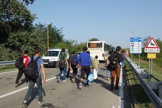 SERBIA, Border with Croatia: Refugees camp out at the Serbian-Croatian border on September 18, 2015 after Croatia decided to shut their border with Serbia.This decision was made after more than 11,000 refugees entered Croatia in a single day. Refugees had to spend entire night and half of the next day at the border. Local authorities in Serbia have organized bus transportation to take the refugees from the border to the reception camps.