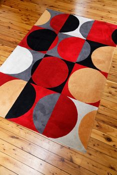 A rug with colourful circular patterns