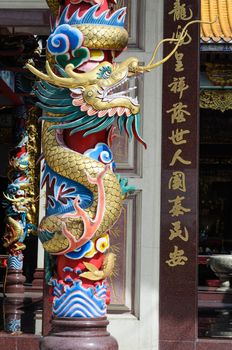 China Dragon statue in china temple roof shot  the beautiful reflected light.