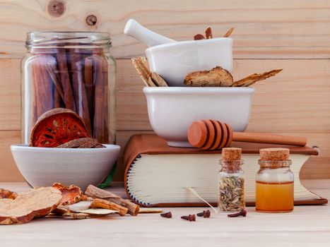 Alternative Medicinal Chinese herbal medicine  for healthy recipe with dry herbs  and mortar on wooden background.