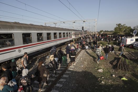 CROATIA, Tovarnik: Refugees line up and wait at the railway station in Tovarnik, Croatia near the Serbian-border on September 18, 2015. Refugees are hoping to continue their journey to Germany and Northern Europe via Slovenia 