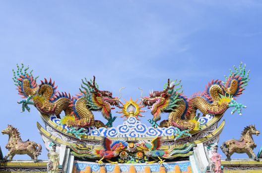 Various color dragons on blue sky , a city is Chon buri , Thailand