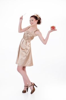 Young beautiful emotional woman with a gift on isolated studio background