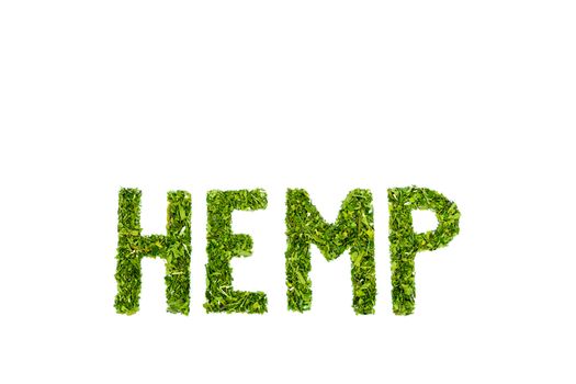 Word HEMP made of cut green hemp leaves isolated on green background