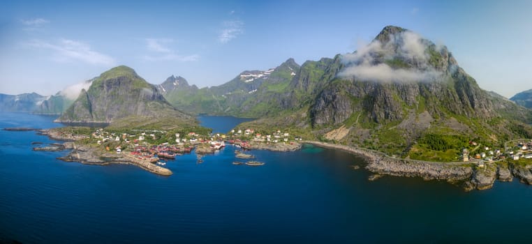 Aerial panorama of scenic fishing village A on Lofoten islands in Norway with traditional red fishing huts