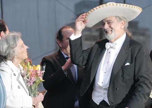 MEXICO, Mexico City: Spanish tenor Placido Domingo (R) is seen after a concert with Mexico Philharmonic Orchestra on September 18, 2015 in Mexico City. Soprano Maria Katzarava, mezzo-soprano Grace Echauri, tenor Dante Alcala and bass Rosendo Flores perfomed Verdi's Requiem in memory of 1985 earthquake.