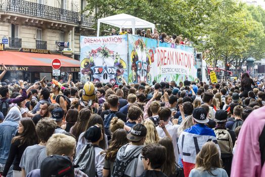 FRANCE, Paris : People dance in the street during the 18th edition of the Techno Parade music event in Paris on September 19, 2015.