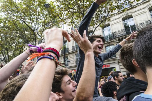 FRANCE, Paris : People dance in the street during the 18th edition of the Techno Parade music event in Paris on September 19, 2015.